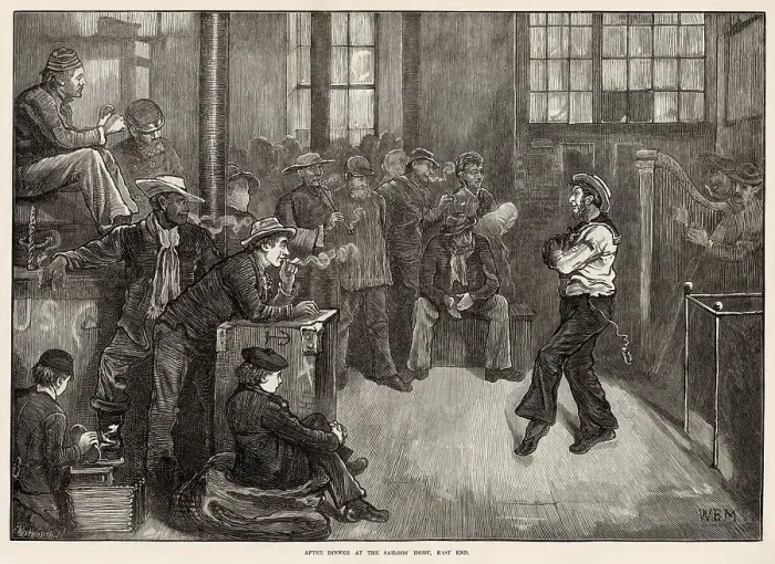 Framed Print : After dinner at the Sailors'Home, in Wells Street, near the London Docks in the East End. A sailor dancing the hornpipe accompanied by a harp. Date: 1873 Framed Print : After dinner at the Sailors'Home, in Wells Street, near the London Docks in the East End. A sailor dancing the hornpipe accompanied by a harp. Date: 1873