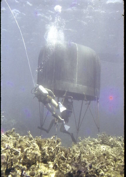 Divers with underwater house off the coast of Malta
