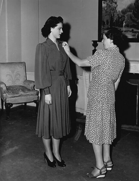 Dolly Tree and Ruth Hussey at a fitting for Flight Command