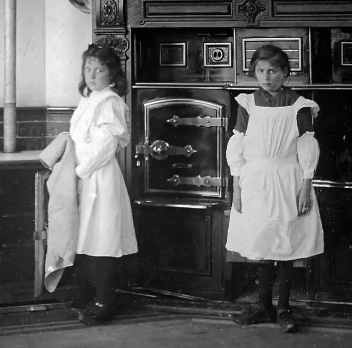 Framed Print : Domestic servants in a kitchen Framed Print : Domestic servants in a kitchen