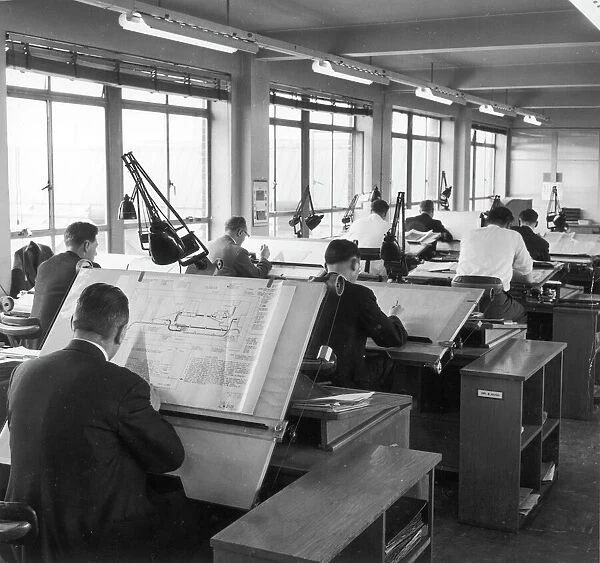 Draughtsmen at work. Draughtsmen prepare technical drawings for an electronic