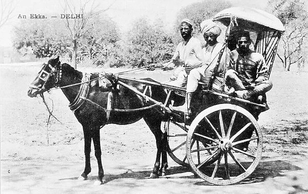 Driver and two passengers in an Ekka, Delhi, India