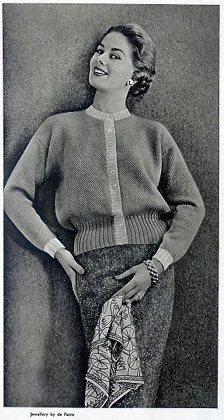 A drop shoulder cardigan in honeycomb stitch, published with instructions on how to create the garment at home. Date: 1954