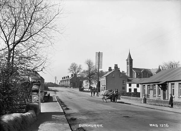 Dunmurry - a view of the main street with people and horse vehicle