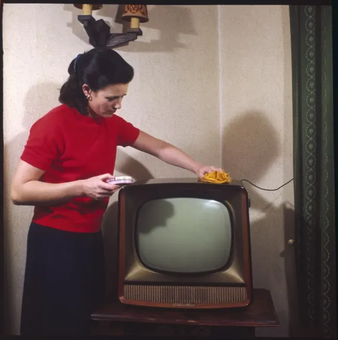 Framed Print : Dusting a Television Framed Print : Dusting a Television