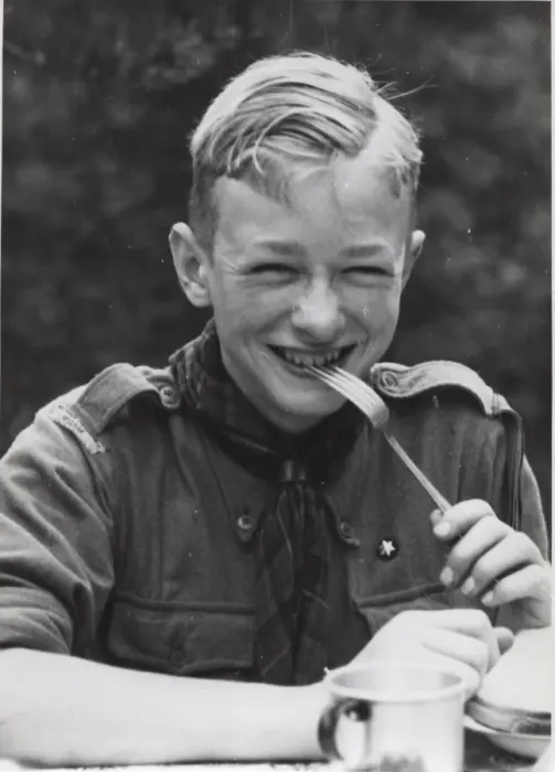 Framed Print : Dutch boy scout eating at camp, Holland Framed Print : Dutch boy scout eating at camp, Holland