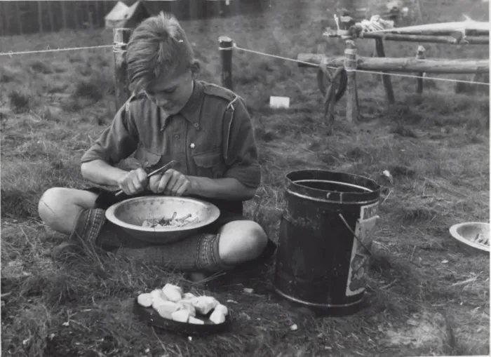 Framed Print : Dutch boy scout preparing vegetables, Holland Framed Print : Dutch boy scout preparing vegetables, Holland