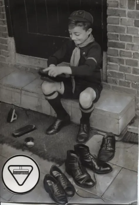Framed Print : Dutch cub scout polishing shoes, Netherlands Framed Print : Dutch cub scout polishing shoes, Netherlands