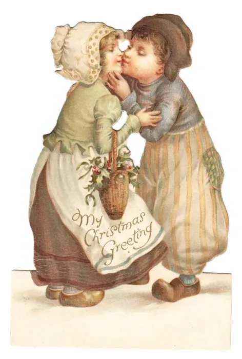 Framed Print : Dutch girl and boy kissing on a cutout Christmas card Framed Print : Dutch girl and boy kissing on a cutout Christmas card