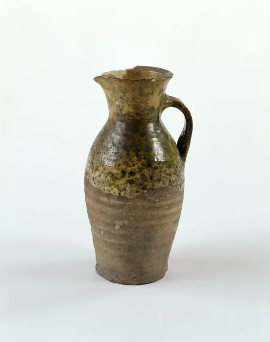 Framed Print : Jug. Earthenware jug with green glaze decoration, a handle Framed Print : Jug. Earthenware jug with green glaze decoration, a handle