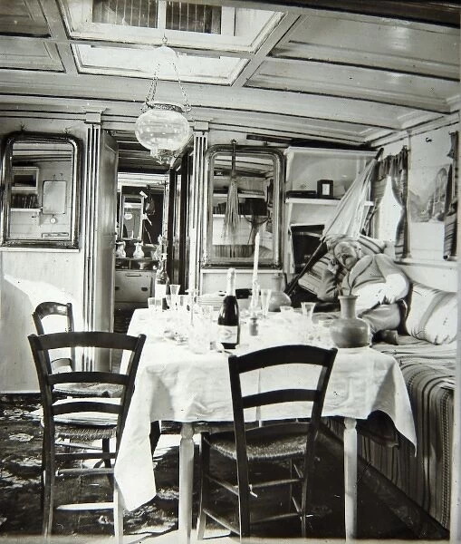 Edwardian boat interior, with table and chairs