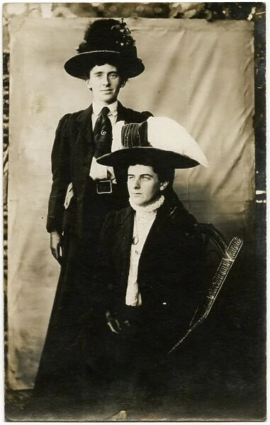 Two Edwardian men dressed as suffragettes