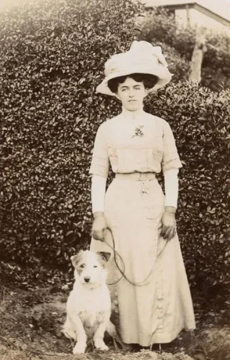 Framed Print : Edwardian woman with a terrier in a garden Framed Print : Edwardian woman with a terrier in a garden