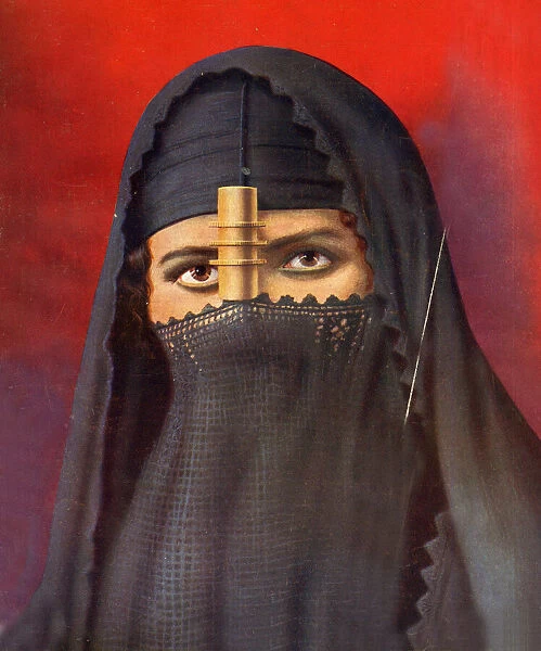 Egyptian woman in face veil with gilt cylinder, Egypt