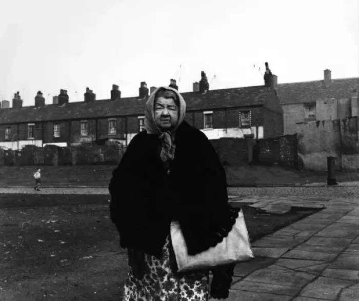 Framed Print : Elderly lady in front of Liverpool housing Framed Print : Elderly lady in front of Liverpool housing
