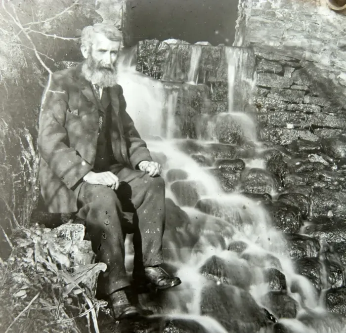 Framed Print : Elderly man sitting by mill outflow Framed Print : Elderly man sitting by mill outflow