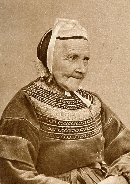 Elderly woman in traditional costume, France