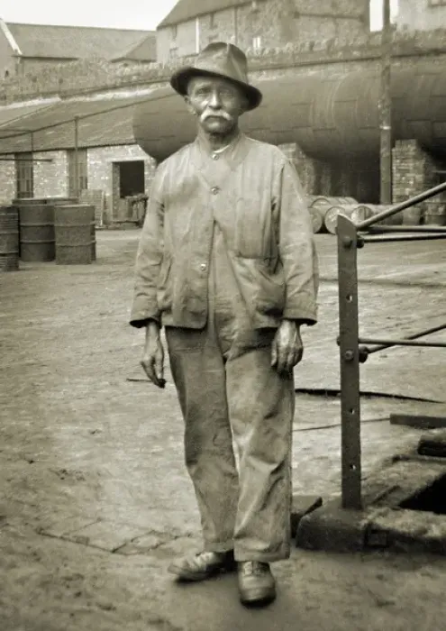 Framed Print : Elderly workman in a yard Framed Print : Elderly workman in a yard