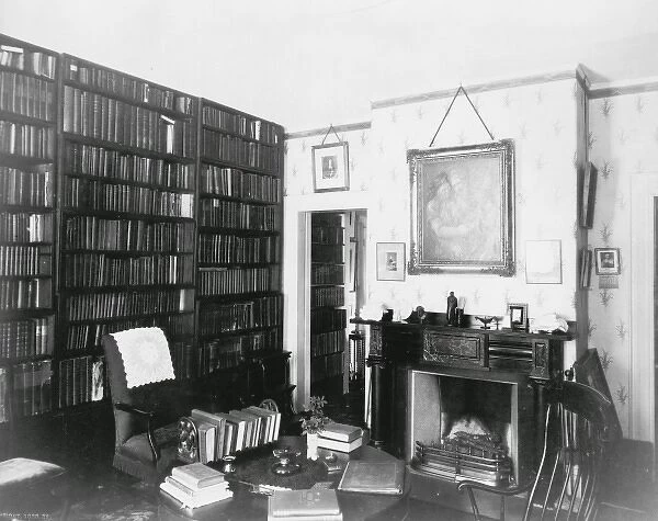 Emersons study showing shelves of books, fireplace and desk