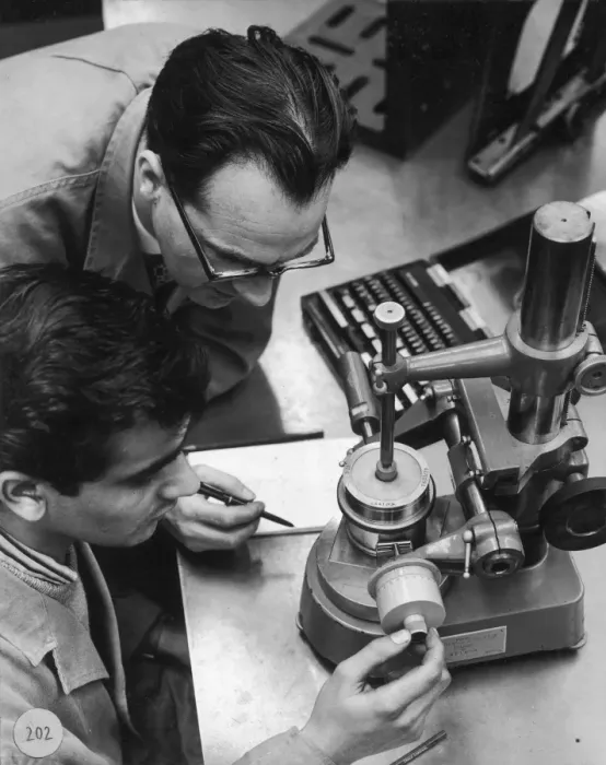Framed Print : Two engineers using a measurement device Framed Print : Two engineers using a measurement device