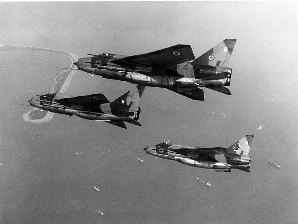 An English Electric Lightning T5 leads two Lightning F6s