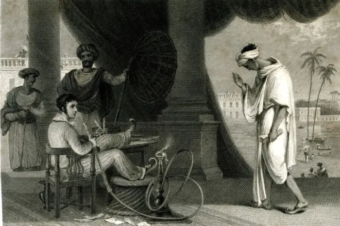 Framed Print : Englishman sitting smoking a hookah, India Framed Print : Englishman sitting smoking a hookah, India