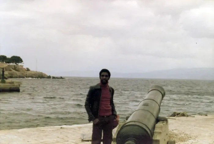 Framed Print : Errol Holder standing beside the cannon on a Greek Island Framed Print : Errol Holder standing beside the cannon on a Greek Island