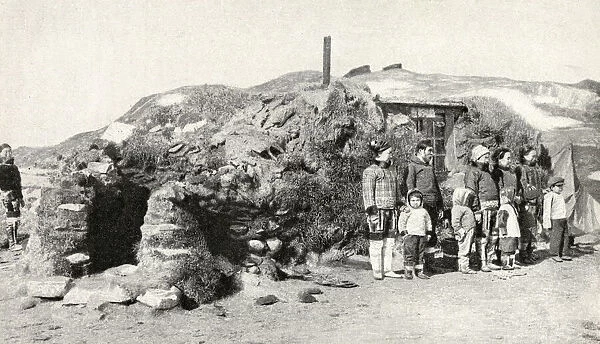 Eskimos outside their summer residence, Greenland