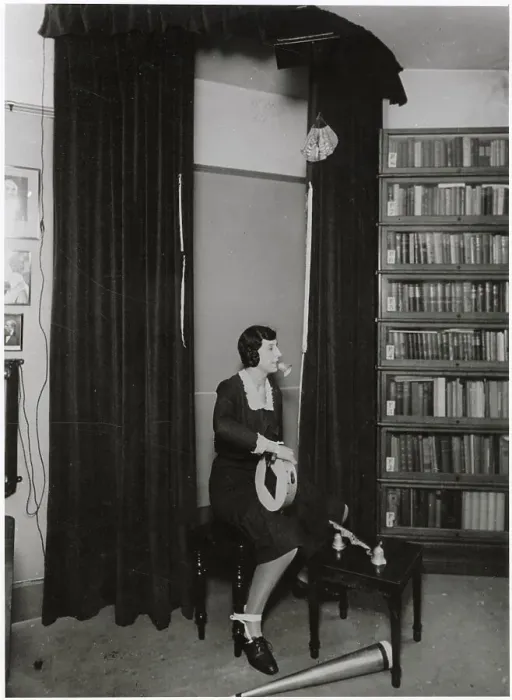 Framed Print : Ethel Beenham, Harry Price's secretary, demonstrates how a skilful medium can perform any number of psychic phenomena even though her hands and feet are tied. Date: 1930s ? Framed Print : Ethel Beenham, Harry Price's secretary, demonstrates how a skilful medium can perform any number of psychic phenomena even though her hands and feet are tied. Date: 1930s ?