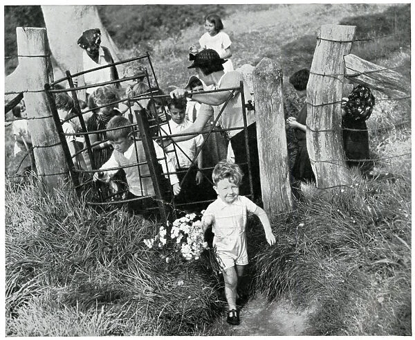 Evacuee children walking through countryside gate, Sept 1939
