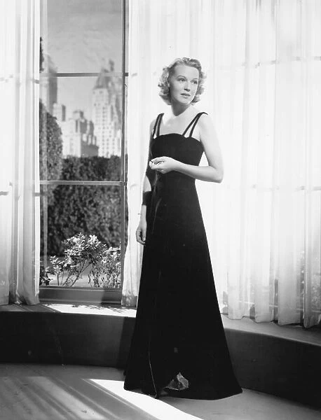 An evening dress for Rita Johnson in Manproof (1938)