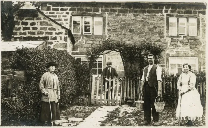 Framed Print : Extended family outside stone county home