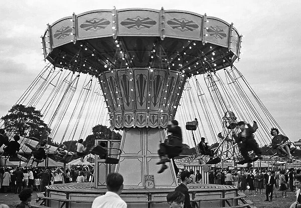 Fairground carousel with riders