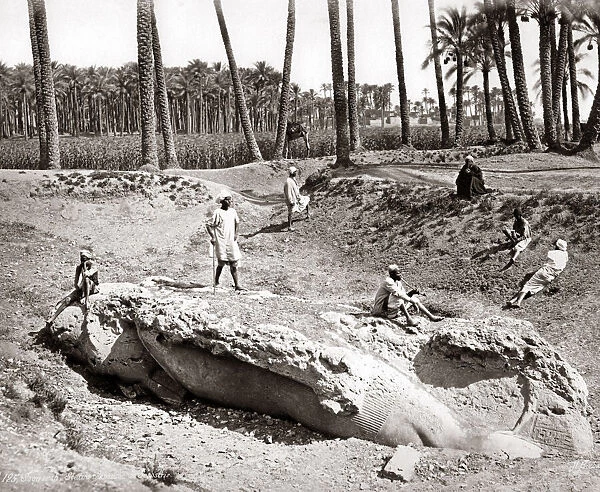 The fallen statue of Seostris, Memphis, Egypt, circa 1880s. Date: circa 1880s