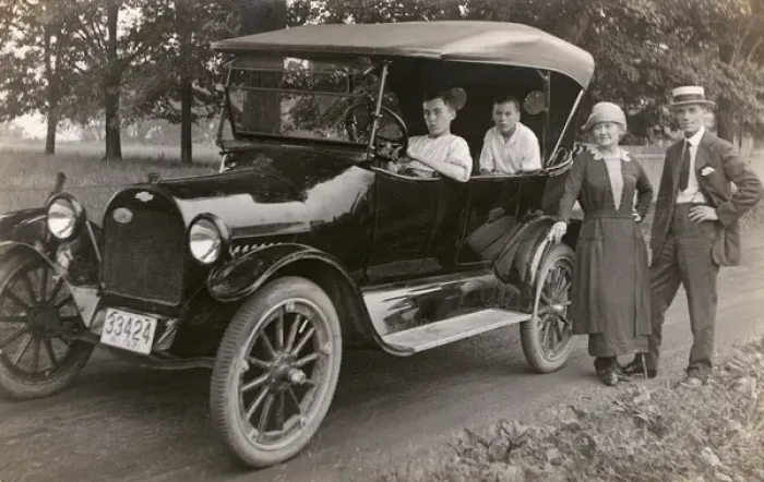 Framed Print : Family of four with their car, Rhode Island, USA Framed Print : Family of four with their car, Rhode Island, USA