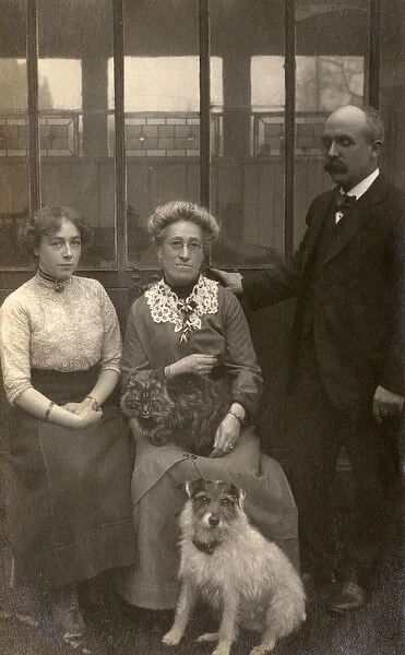 Family of three with a dog and a cat