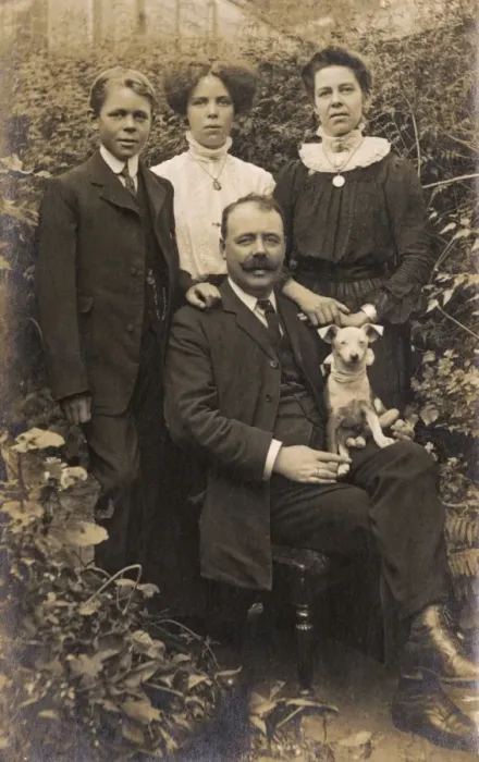 Framed Print : Family of four and dog in garden Framed Print : Family of four and dog in garden