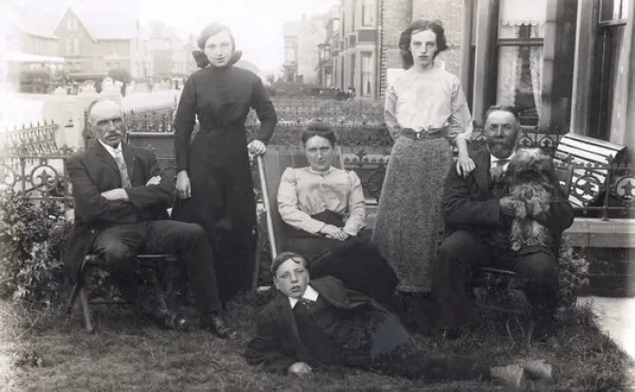 Framed Print : Family of six with a dog in a front garden Framed Print : Family of six with a dog in a front garden