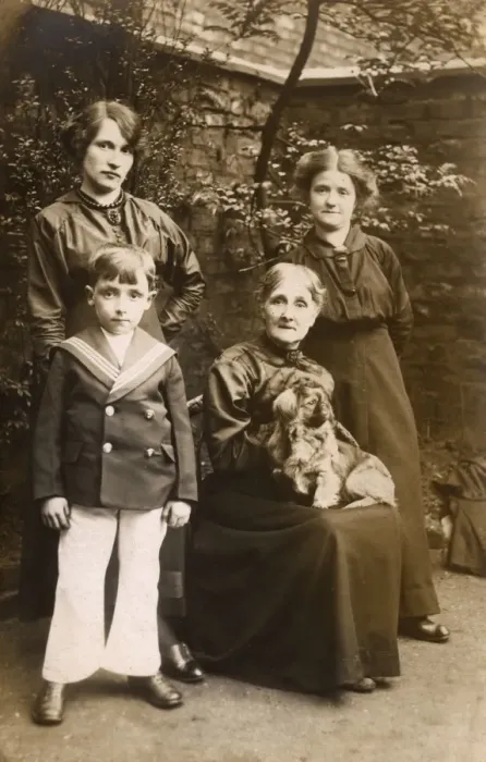Framed Print : Family of four with a dog in a garden Framed Print : Family of four with a dog in a garden