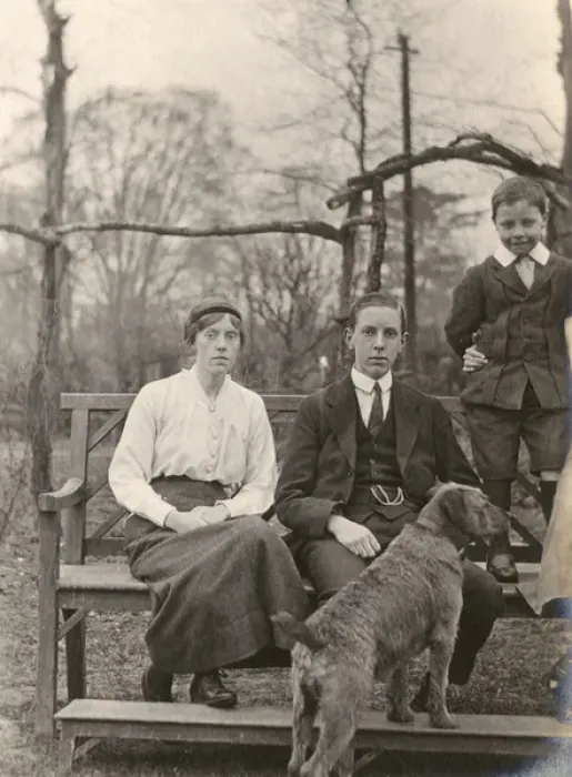 Framed Print : Family group with a dog in a garden Framed Print : Family group with a dog in a garden