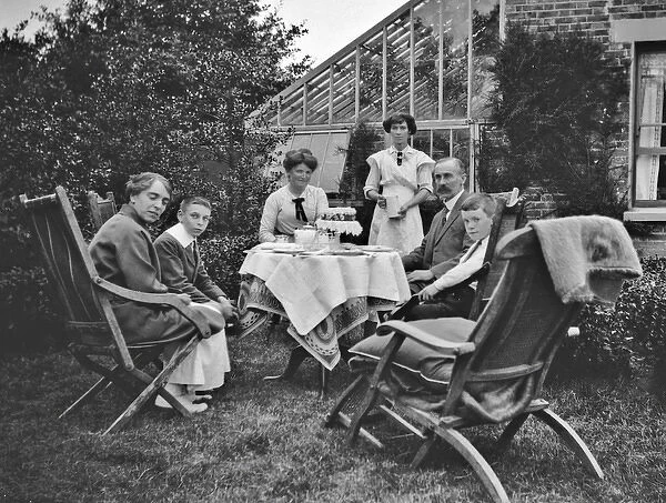Family group of six in a garden