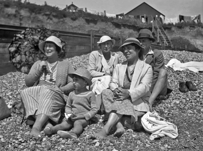 Framed Print : Family group on a pebbly beach at the seaside Framed Print : Family group on a pebbly beach at the seaside