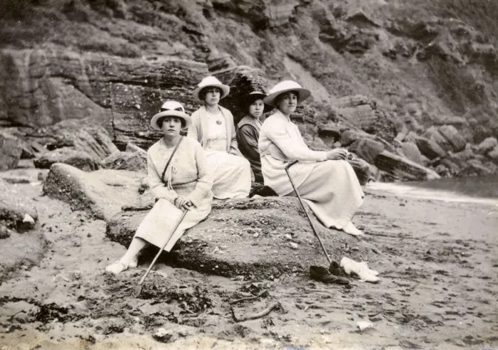 Framed Print : Family group sitting on a beach at the seaside Framed Print : Family group sitting on a beach at the seaside
