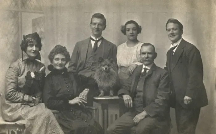 Framed Print : Family group studio portrait with small dog Framed Print : Family group studio portrait with small dog