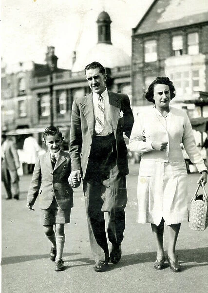 Family of three walking in the street