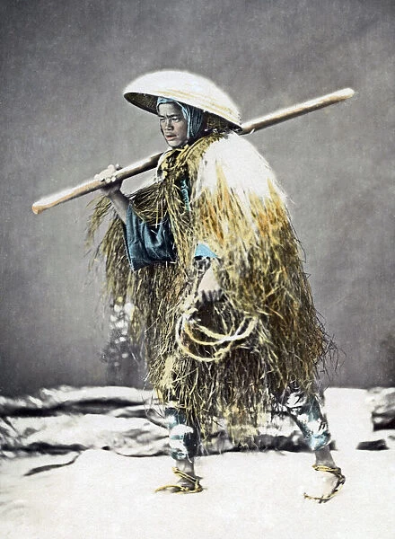 Farmer in grass coat and snow scene, Japan, circa 1880s. Date: circa 1880s