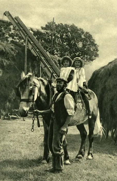 Framed Print : Farmer leading two children on a horse, England Framed Print : Farmer leading two children on a horse, England