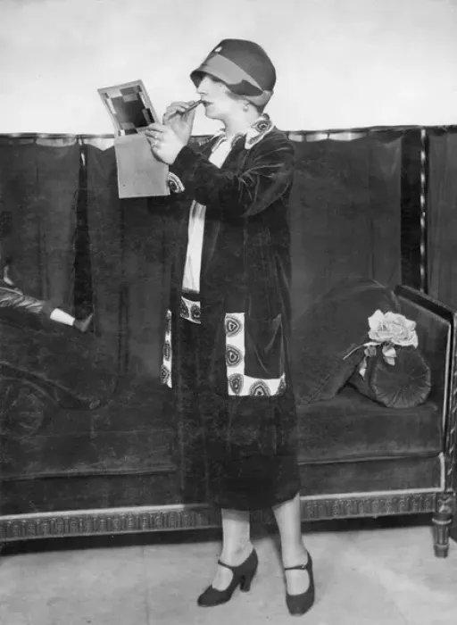 Framed Print : Fashionable woman applying lipstick