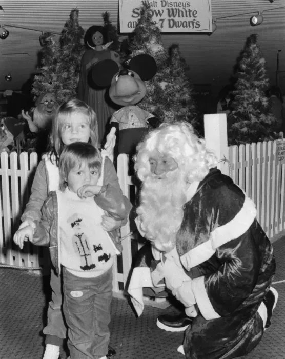 Framed Print : Father Christmas with children in his grotto Framed Print : Father Christmas with children in his grotto