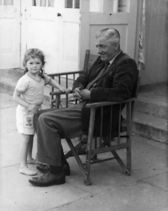 Framed Print : Father and daughter outside beach hut Framed Print : Father and daughter outside beach hut